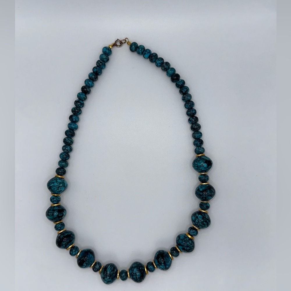 Beautiful blue and black marbled bracket with gold accents